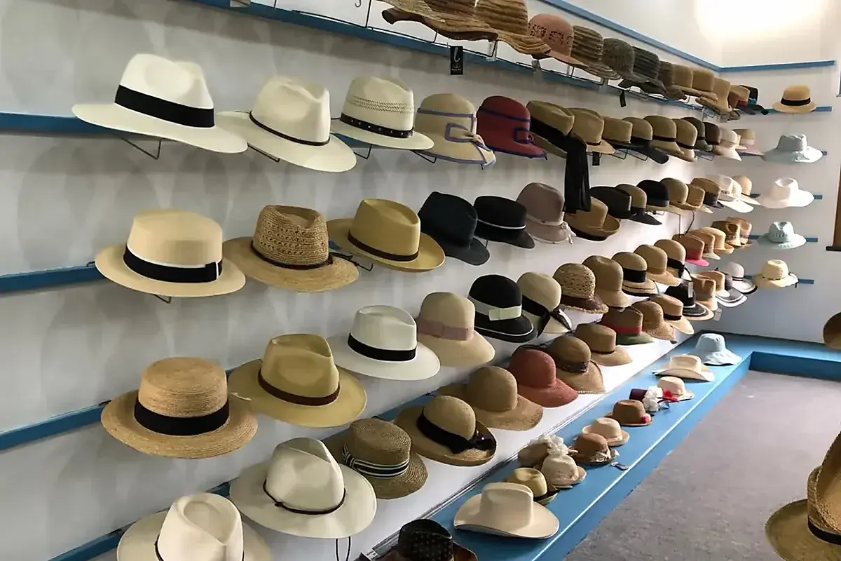 Beach and straw hat samples displayed in the LuxoHat sample room