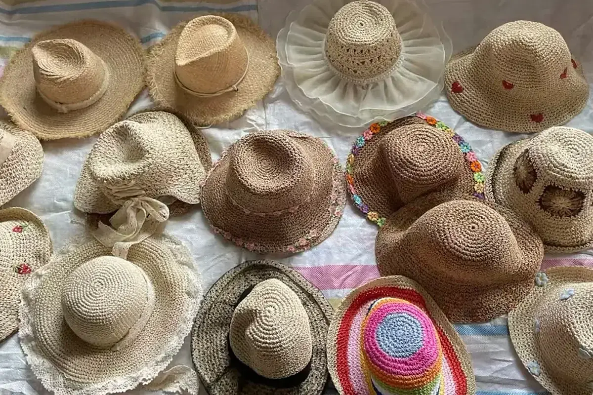 Assorted straw hats prepared for guest and event programs