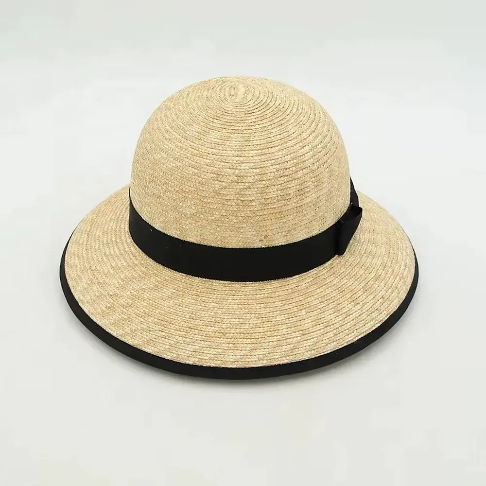 Natural wide-brim beach straw hat with a black band and edge