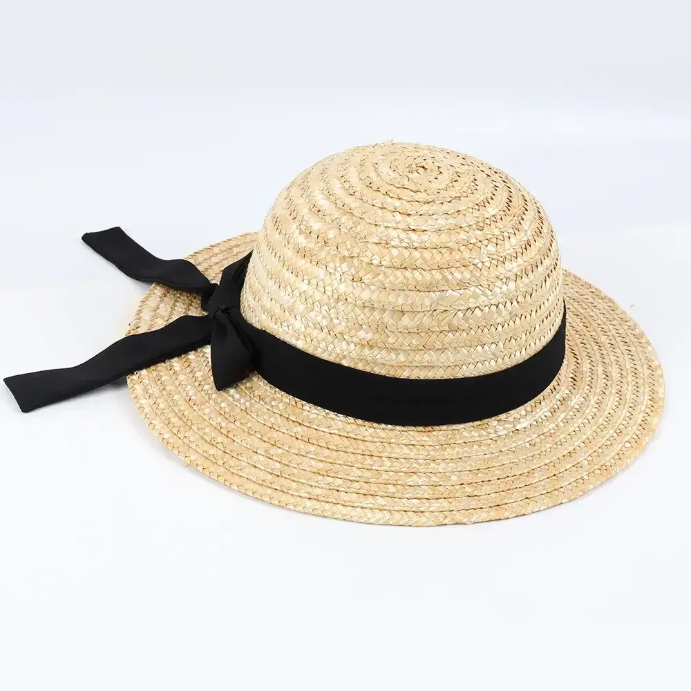 Natural kids boater straw hat with an oversized black bow