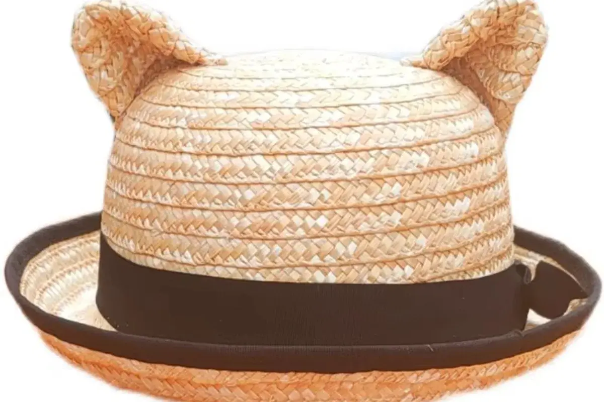 Natural kids straw hat with a compact crown, short brim, and cat-ear details