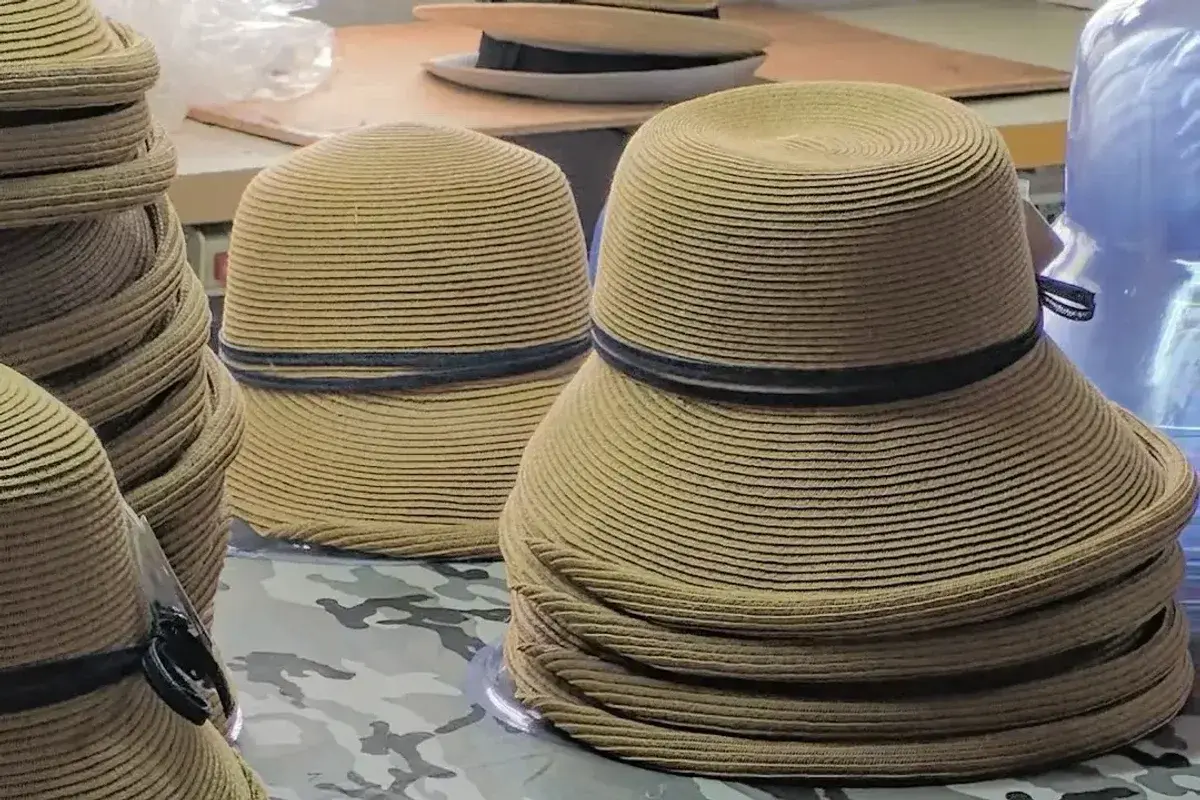 Stacked hat batches with coordinated bands for production identification