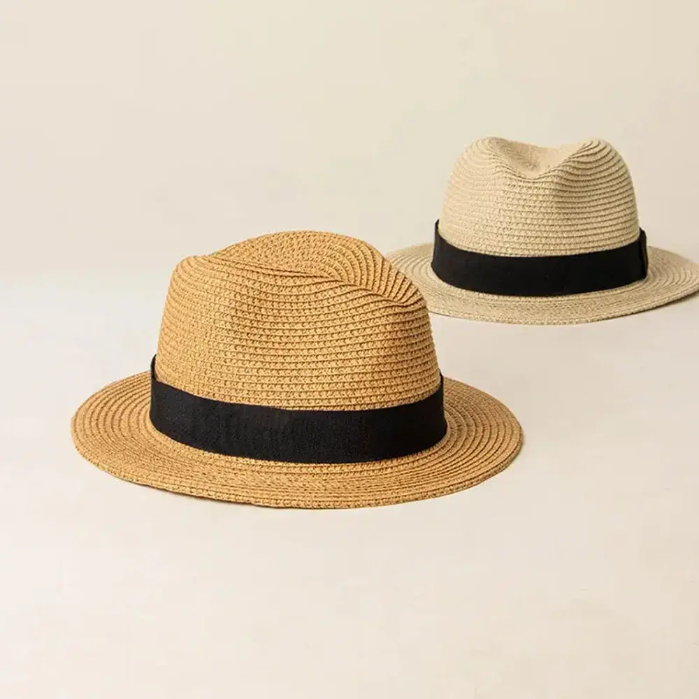 Two short-brim Panama-style hats with black bands