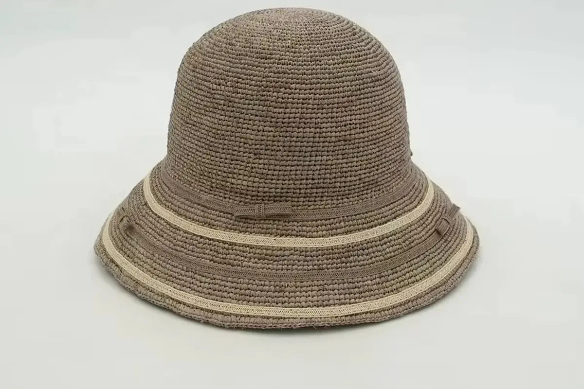 Striped raffia bucket hat showing a continuous downward brim profile