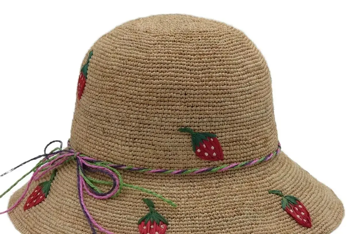 Natural straw bucket hat with strawberry embroidery details