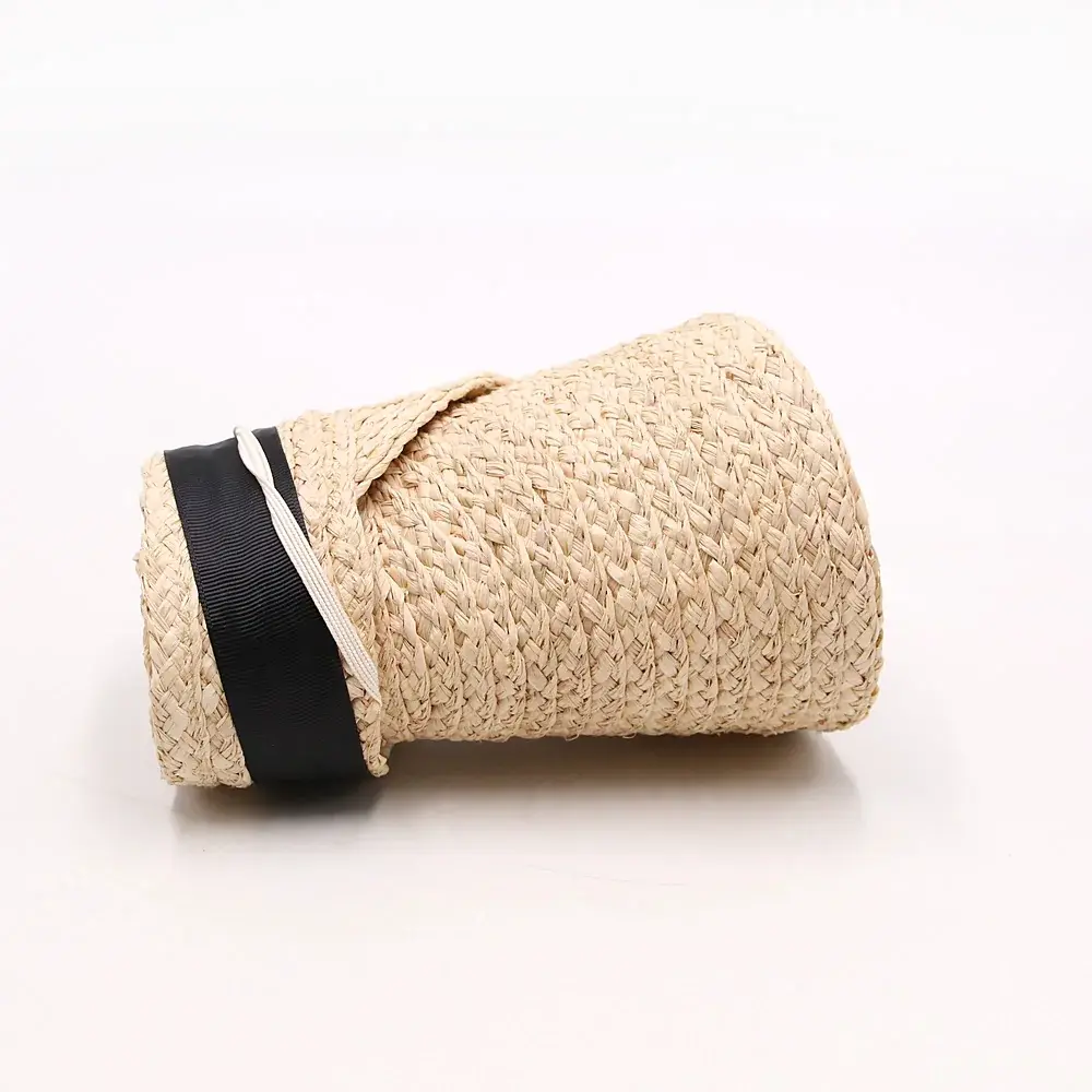 Natural roll-up straw visor secured with a black band