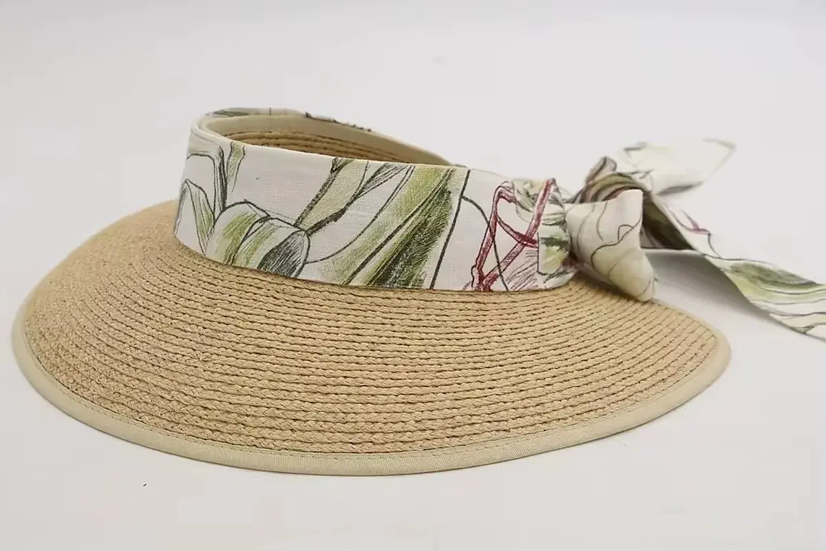 Straw visor with a wide fabric headband and soft tie-back finish