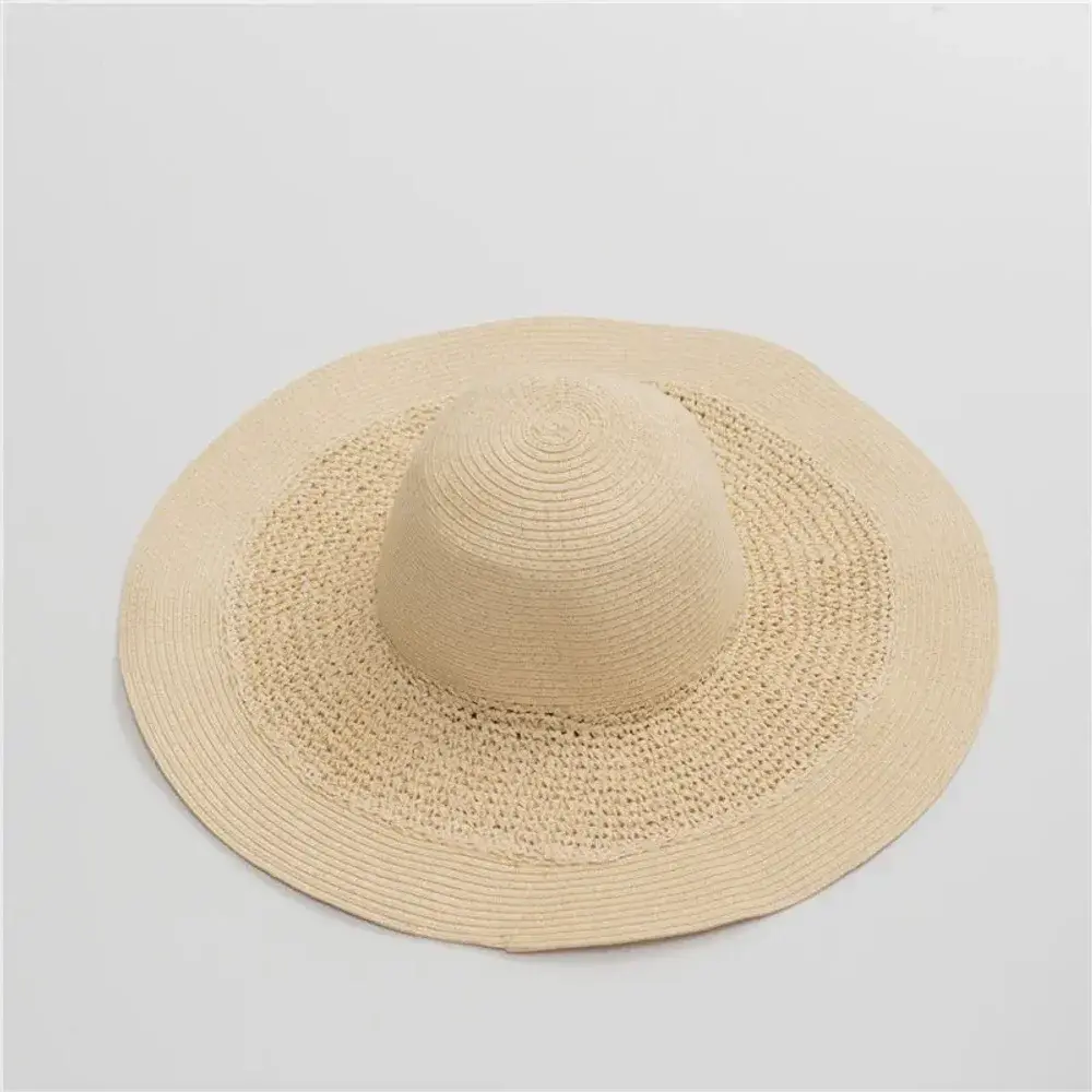 Oversized natural crochet straw hat with an extra-wide brim