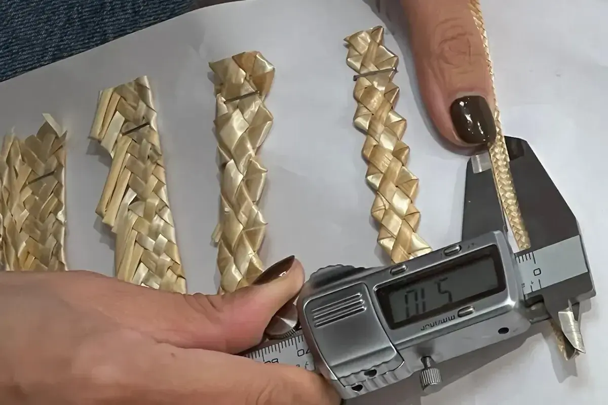 Digital caliper measuring natural straw braid for brim development