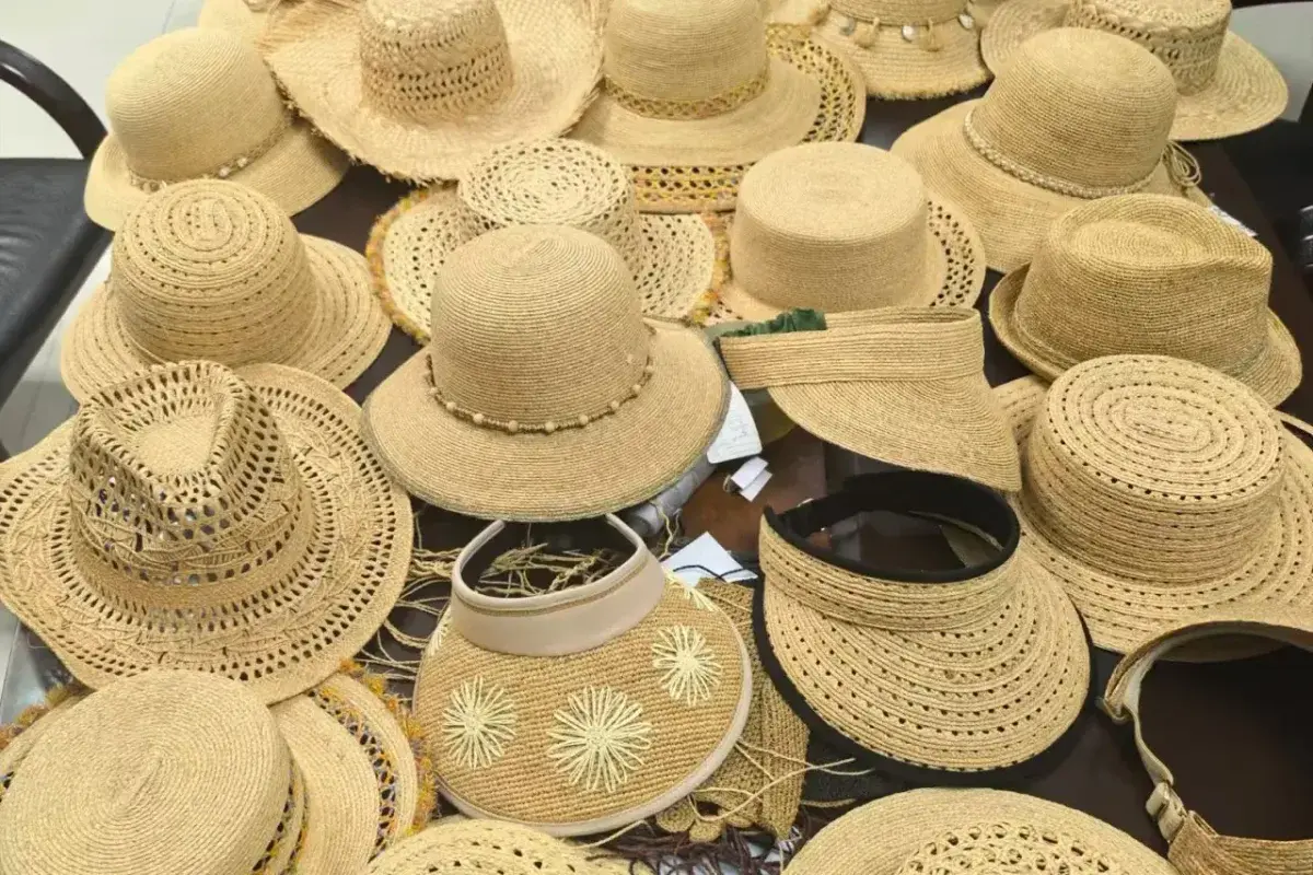 Assorted straw hat samples showing different brim shapes and crown profiles