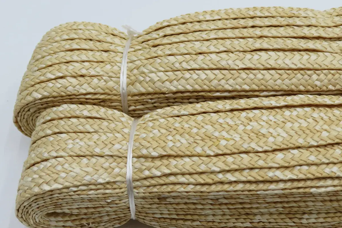 Bundled natural straw braid prepared for wide-brim hat construction