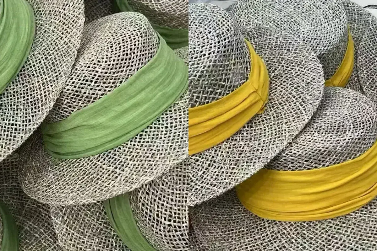 Factory straw hat samples with green and yellow wrapped fabric bands