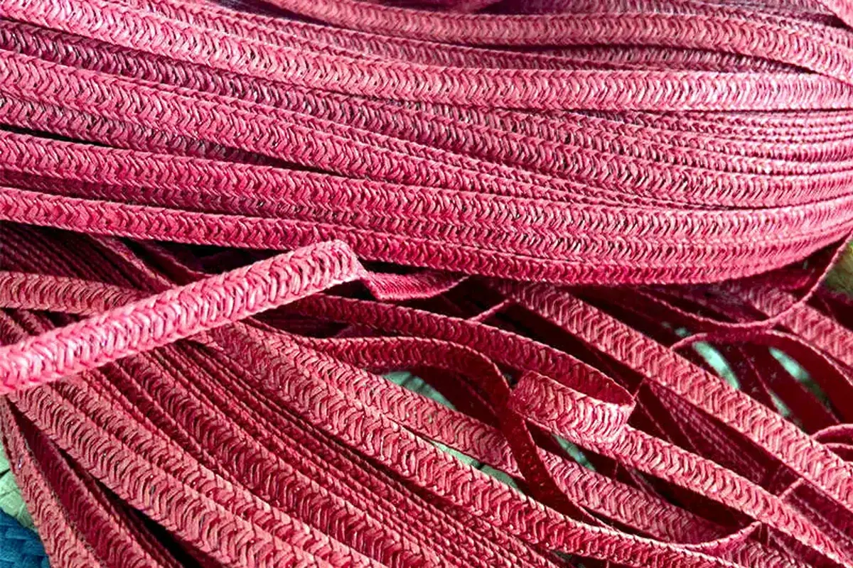 Colored paper straw braids prepared for custom hat production