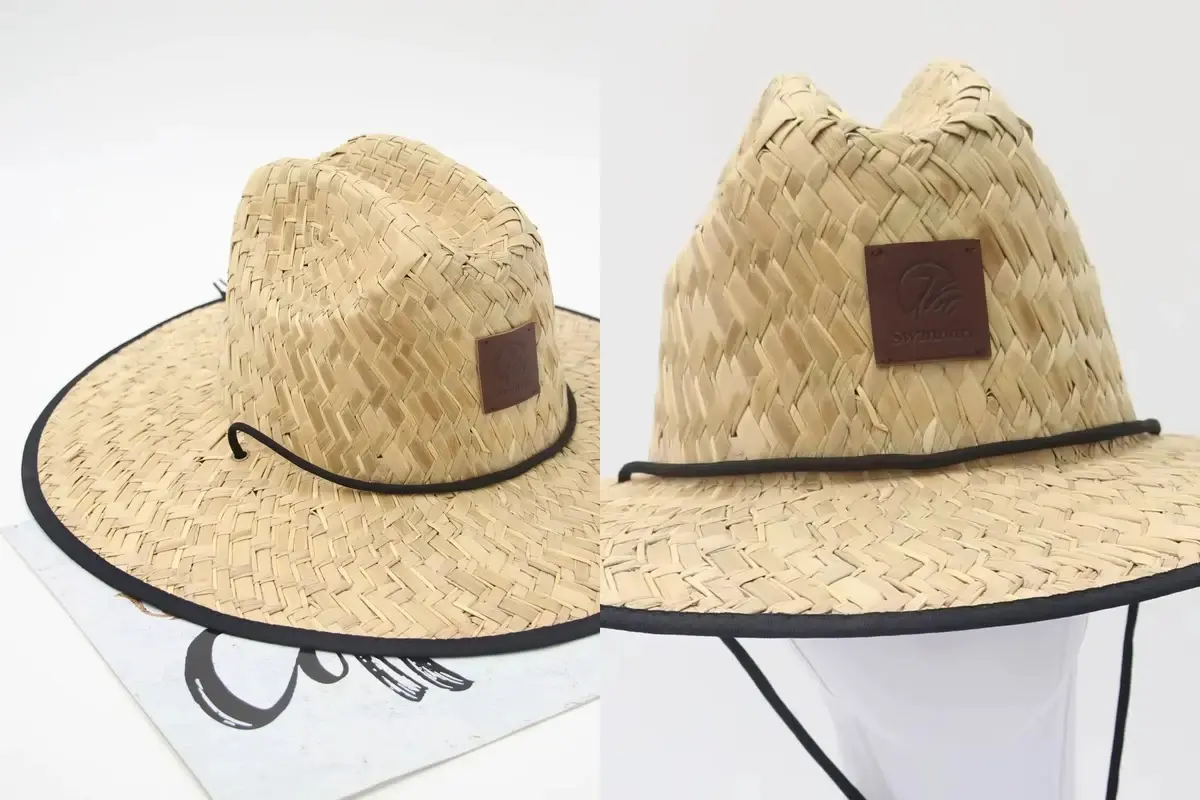 Two straw hats with brown leather-look patches mounted on the crown