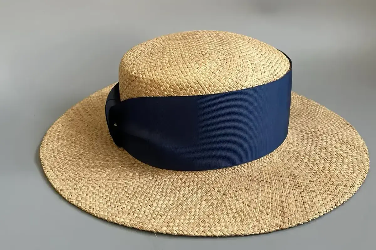 Approved wide-brim straw hat sample with a navy band