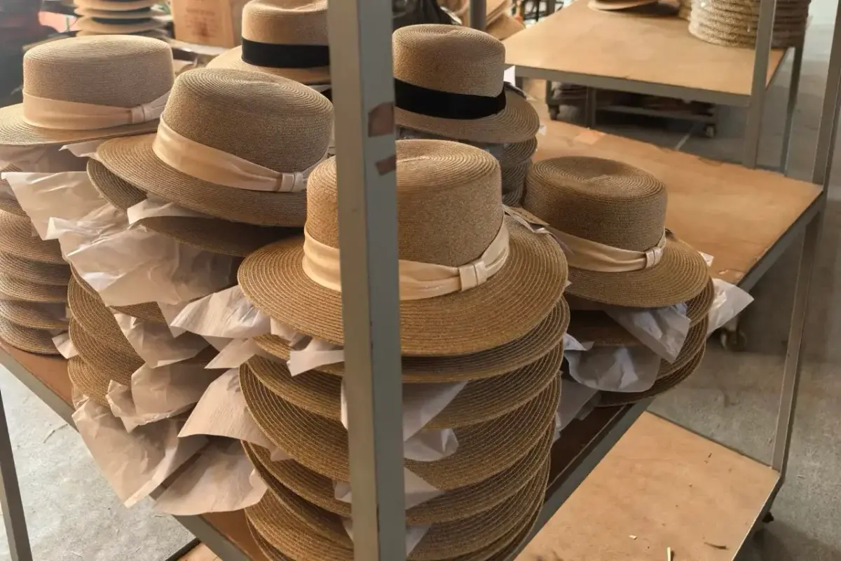 Finished straw hats nested with paper protection for shipment preparation