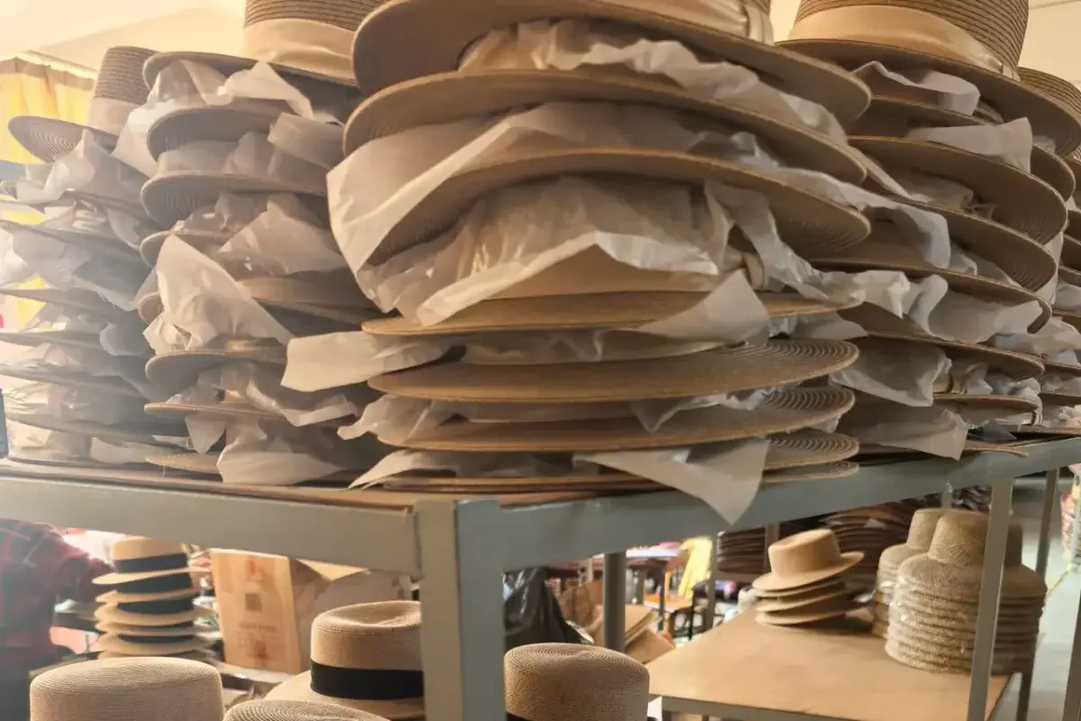 Finished hats nested with paper layers for packaging review
