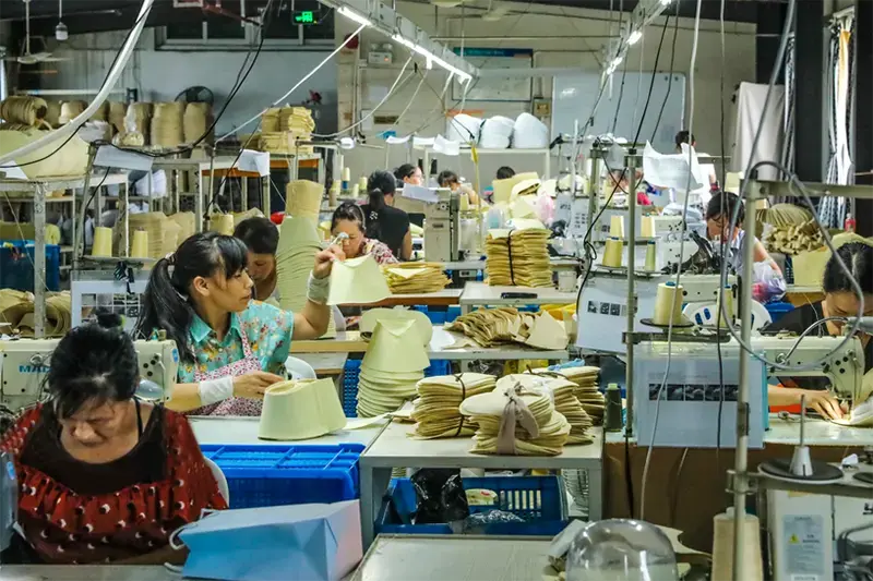 LuxoHat workshop team producing straw hat components